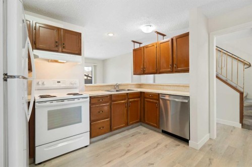 35 Shawmeadows Close Sw, Calgary, AB - Indoor Photo Showing Kitchen With Double Sink