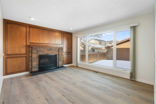 35 Shawmeadows Close Sw, Calgary, AB - Indoor Photo Showing Living Room With Fireplace