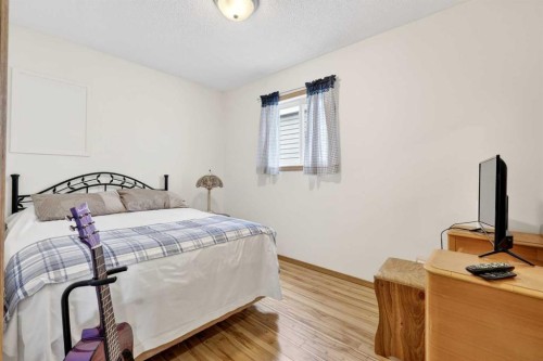 886 Erin Woods Drive Se, Calgary, AB - Indoor Photo Showing Bedroom
