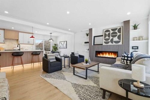 8616 7 Street Sw, Calgary, AB - Indoor Photo Showing Living Room With Fireplace