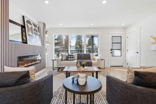 8616 7 Street Sw, Calgary, AB - Indoor Photo Showing Living Room With Fireplace