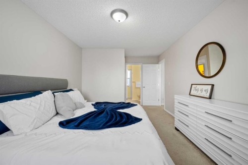 8 Chapalina Crescent Se, Calgary, AB - Indoor Photo Showing Bedroom