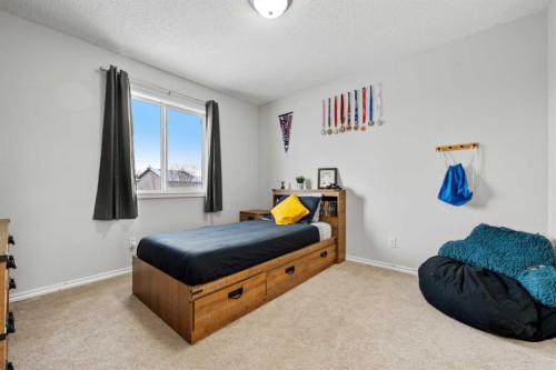 8 Chapalina Crescent Se, Calgary, AB - Indoor Photo Showing Bedroom
