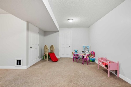 8 Chapalina Crescent Se, Calgary, AB - Indoor Photo Showing Other Room