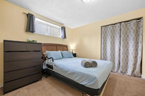 8 Chapalina Crescent Se, Calgary, AB - Indoor Photo Showing Bedroom