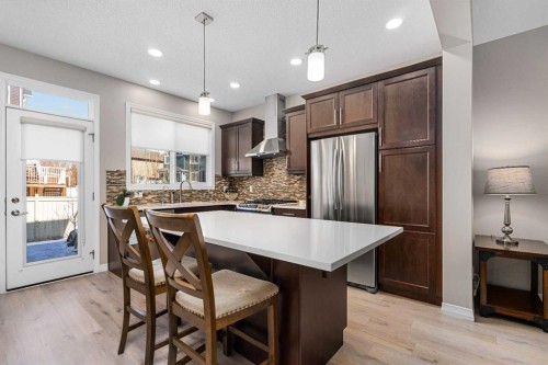58 Kingfisher Crescent Se, Airdrie, AB - Indoor Photo Showing Kitchen With Stainless Steel Kitchen With Upgraded Kitchen