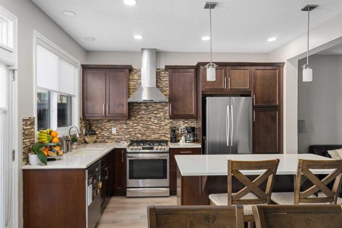 58 Kingfisher Crescent Se, Airdrie, AB - Indoor Photo Showing Kitchen With Stainless Steel Kitchen With Upgraded Kitchen