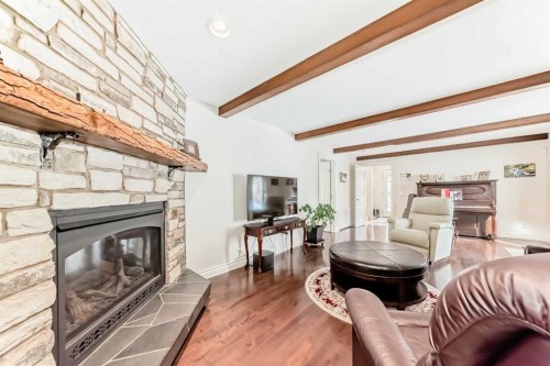 332 Varsity Close Nw, Calgary, AB - Indoor Photo Showing Living Room With Fireplace