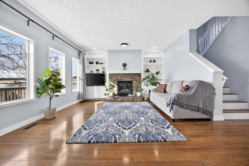 162 Prestwick Landing Se, Calgary, AB - Indoor Photo Showing Living Room With Fireplace