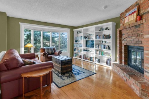 44 Sprucegrove Crescent Se, Airdrie, AB - Indoor Photo Showing Living Room With Fireplace