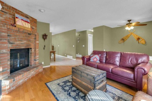 44 Sprucegrove Crescent Se, Airdrie, AB - Indoor Photo Showing Living Room With Fireplace