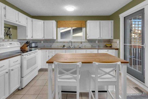 44 Sprucegrove Crescent Se, Airdrie, AB - Indoor Photo Showing Kitchen With Double Sink