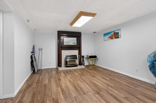 5122 48 Street Nw, Calgary, AB - Indoor With Fireplace