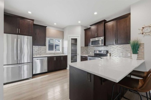 8 Evanscrest Way Nw, Calgary, AB - Indoor Photo Showing Kitchen With Stainless Steel Kitchen With Upgraded Kitchen