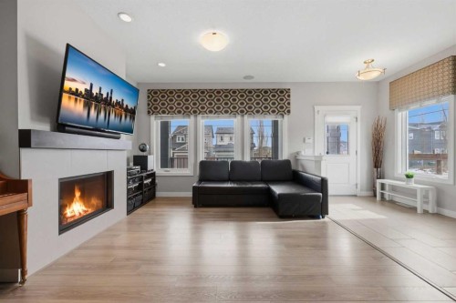 8 Evanscrest Way Nw, Calgary, AB - Indoor Photo Showing Living Room With Fireplace