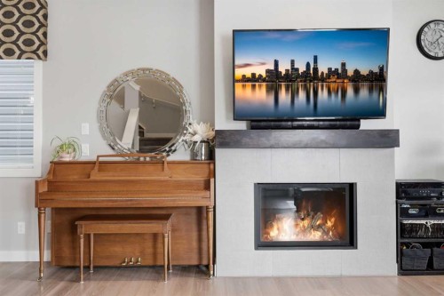 8 Evanscrest Way Nw, Calgary, AB - Indoor Photo Showing Living Room With Fireplace