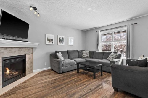564 Morningside Park Sw, Airdrie, AB - Indoor Photo Showing Living Room With Fireplace