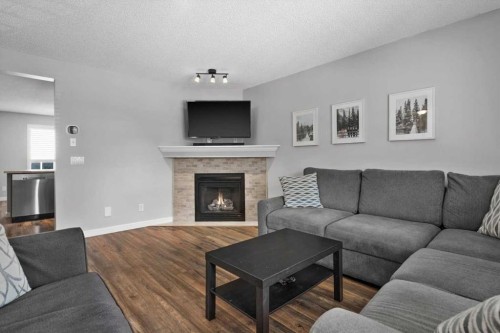 564 Morningside Park Sw, Airdrie, AB - Indoor Photo Showing Living Room With Fireplace