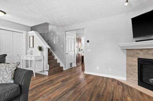 564 Morningside Park Sw, Airdrie, AB - Indoor Photo Showing Living Room With Fireplace