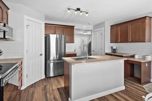 564 Morningside Park Sw, Airdrie, AB - Indoor Photo Showing Kitchen With Double Sink With Upgraded Kitchen