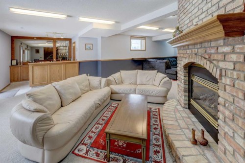 232 Hampshire Place Nw, Calgary, AB - Indoor With Fireplace