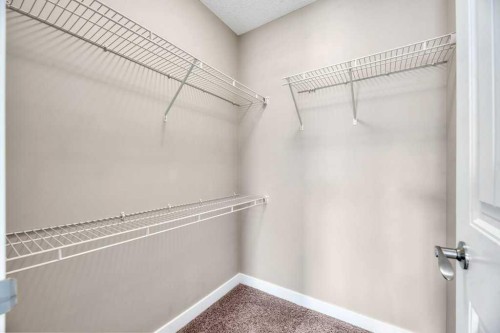 1205-230 Eversyde Boulevard Sw, Calgary, AB - Indoor With Storage