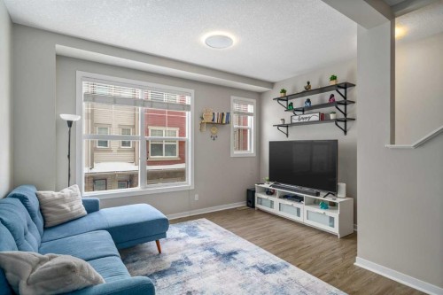 37 New Brighton Point Se, Calgary, AB - Indoor Photo Showing Living Room