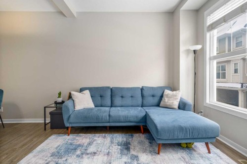 37 New Brighton Point Se, Calgary, AB - Indoor Photo Showing Living Room