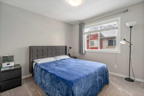 37 New Brighton Point Se, Calgary, AB - Indoor Photo Showing Bedroom
