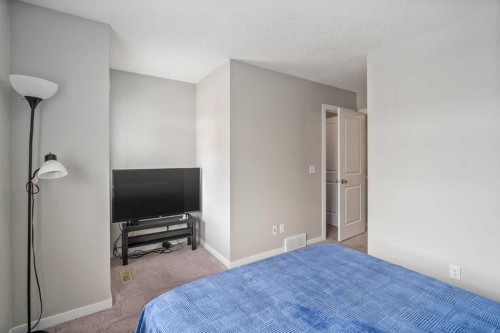 37 New Brighton Point Se, Calgary, AB - Indoor Photo Showing Bedroom