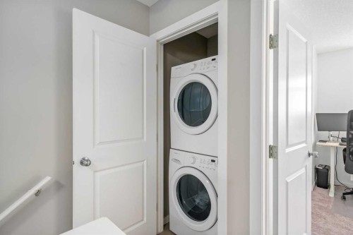 37 New Brighton Point Se, Calgary, AB - Indoor Photo Showing Laundry Room