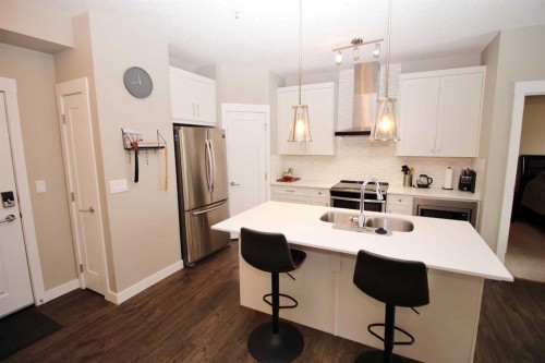 211-200 Auburn Meadows Common Se, Calgary, AB - Indoor Photo Showing Kitchen With Stainless Steel Kitchen With Double Sink With Upgraded Kitchen