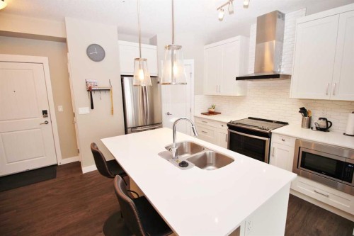 211-200 Auburn Meadows Common Se, Calgary, AB - Indoor Photo Showing Kitchen With Stainless Steel Kitchen With Double Sink With Upgraded Kitchen
