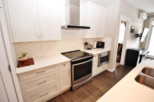 211-200 Auburn Meadows Common Se, Calgary, AB - Indoor Photo Showing Kitchen With Double Sink