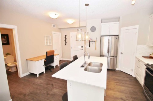 211-200 Auburn Meadows Common Se, Calgary, AB - Indoor Photo Showing Kitchen With Stainless Steel Kitchen With Double Sink With Upgraded Kitchen