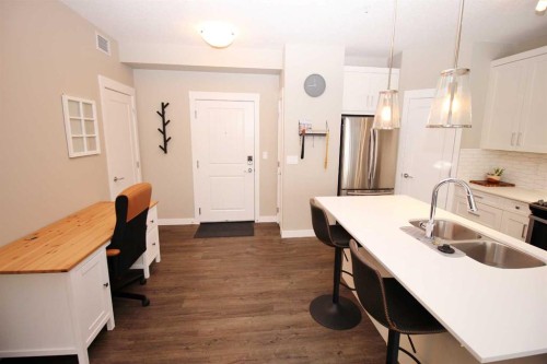 211-200 Auburn Meadows Common Se, Calgary, AB - Indoor Photo Showing Kitchen With Double Sink