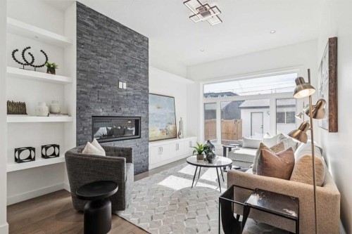 1765 7 Avenue Nw, Calgary, AB - Indoor Photo Showing Living Room With Fireplace