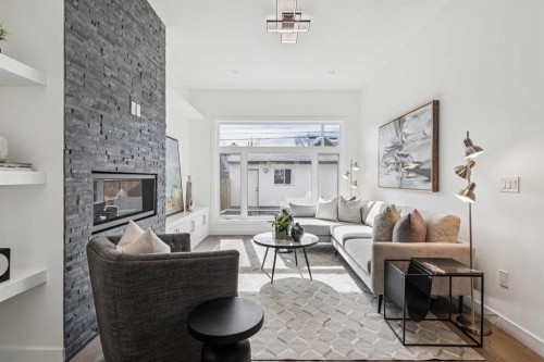 1765 7 Avenue Nw, Calgary, AB - Indoor Photo Showing Living Room With Fireplace