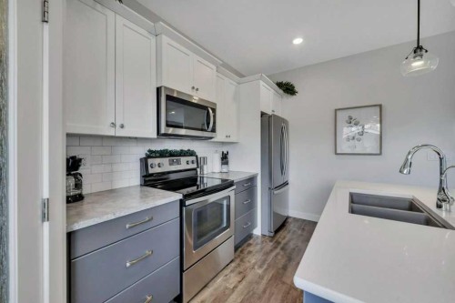 57 Hampton Crescent, Sylvan Lake, AB - Indoor Photo Showing Kitchen With Stainless Steel Kitchen With Double Sink With Upgraded Kitchen