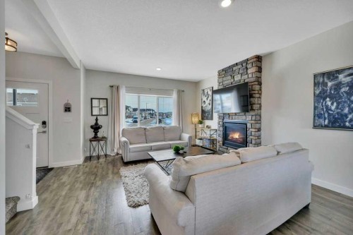 57 Hampton Crescent, Sylvan Lake, AB - Indoor Photo Showing Living Room With Fireplace