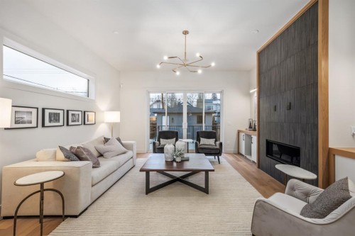 727 15 Street Nw, Calgary, AB - Indoor Photo Showing Living Room With Fireplace