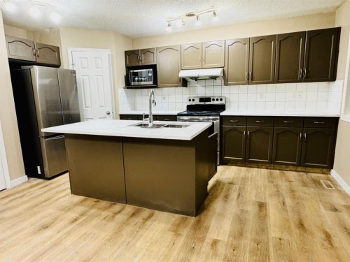 184 Taralake Terrace Ne, Calgary, AB - Indoor Photo Showing Kitchen With Double Sink