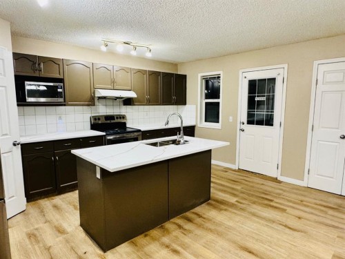 184 Taralake Terrace Ne, Calgary, AB - Indoor Photo Showing Kitchen With Double Sink