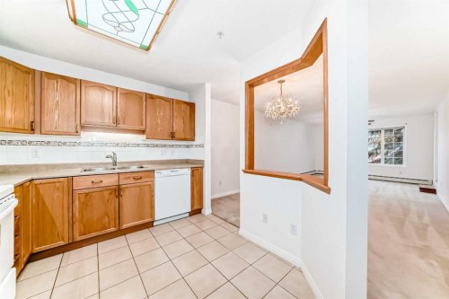 3202 Sienna Park Green Sw, Calgary, AB - Indoor Photo Showing Kitchen With Double Sink