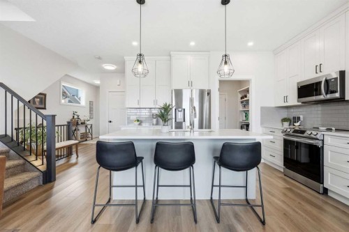 376 Fireside Way, Cochrane, AB - Indoor Photo Showing Kitchen With Upgraded Kitchen