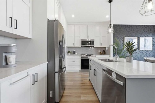 376 Fireside Way, Cochrane, AB - Indoor Photo Showing Kitchen With Double Sink With Upgraded Kitchen