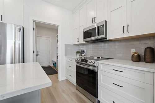 376 Fireside Way, Cochrane, AB - Indoor Photo Showing Kitchen With Upgraded Kitchen