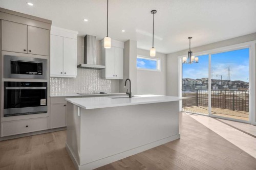 151 Dawson Wharf Mount, Chestermere, AB - Indoor Photo Showing Kitchen With Upgraded Kitchen