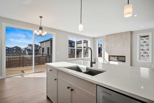 151 Dawson Wharf Mount, Chestermere, AB - Indoor Photo Showing Kitchen With Double Sink