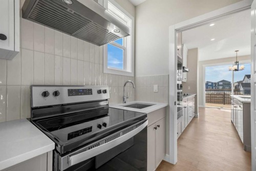 151 Dawson Wharf Mount, Chestermere, AB - Indoor Photo Showing Kitchen With Upgraded Kitchen